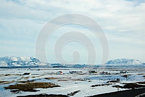 Upcountry town, snow mountain, sunny, Iceland photo