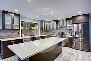 Updated contemporary kitchen room interior in white and dark tones.