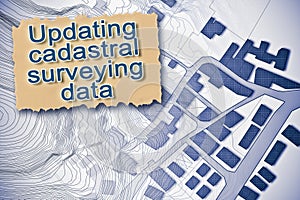 Updating public cadastral digital databases and information about land registry - concept with an imaginary cadastral map of