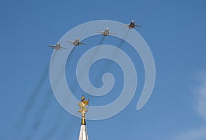 Upgraded front-line bomber with variable sweep wing su-24M during the parade, flying in the sky over red square.