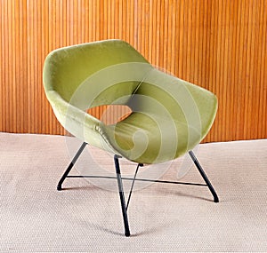 Upholstered green velvet curved vintage armchair