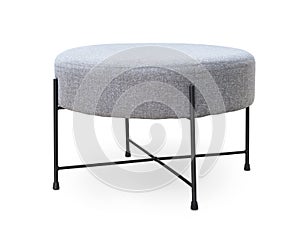 Upholstered round gray footstool