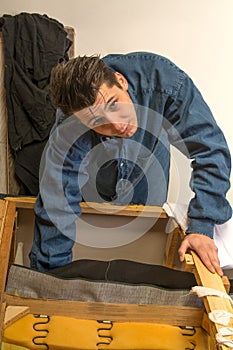 Upholsterer padding a sofa