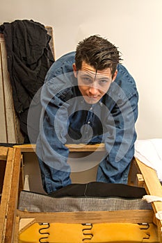 Upholsterer padding a sofa