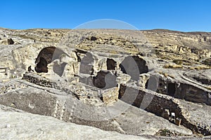 The Uplistsikhe cave complex near Gori, Georgia. Ancient rock-hewn town and three-nave basilica in eastern Georgia