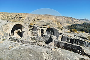 The Uplistsikhe cave complex near Gori, Georgia. Ancient rock-hewn town and three-nave basilica in eastern Georgia