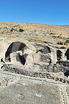 The Uplistsikhe cave complex near Gori, Georgia. Ancient rock-hewn town and three-nave basilica in eastern Georgia