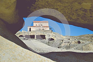 The Uplistsikhe cave complex near Gori, Georgia. Three-nave basilica photographed through a hole in the rock. Ancient