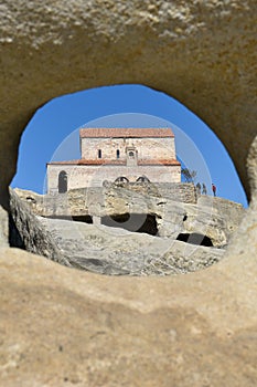 The Uplistsikhe cave complex near Gori, Georgia. Three-nave basilica photographed through a round hole in the rock