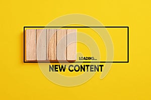 Uploading, downloading or updating new content concept. New content loading progress bar on yellow background