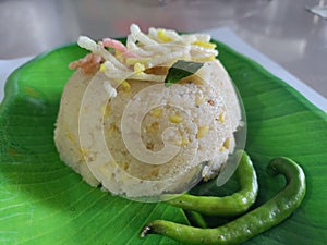 Upma, uppumavu, or uppittu is a dish originating from the Indian subcontinent. photo