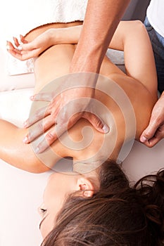Upper back massage technique photo