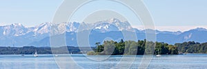 Upper bavarian landscape with Roseninsel rose island and Zugspitze mountain