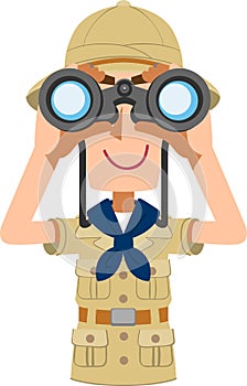 Upper body of a male explorer looking through binoculars