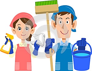 Upper body of man and woman with cleaning tools and aprons