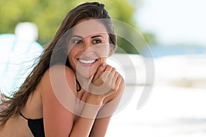 Beautiful smiling woman in a tropical beach