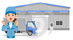 The upper body of a woman in work clothes who guts poses in front of a warehouse and a truck