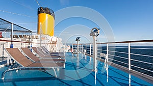 Upper deck of cruise liner with empty chairs