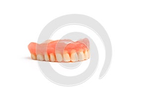 Upper dentures on white background