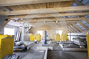 Upper floor with roof beams of a single-family house under construction