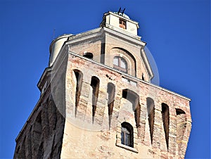 Upper part, illuminated by the sun and surrounded by the blue sky, of the Specola di Padova seat of the ancient astronomical obser