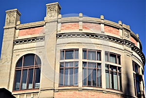 Upper part, immersed in the blue sky, cylindrical in shape, of a historic building hosting a faculty of the University of Padua.