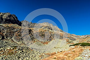 Upper part of Mlynicka dolina valley with peaks above in autumn Vysoke Tatry mountains in Slovakia