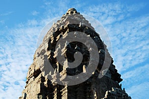 The upper part of one of the towers of the Angkor temple complex. The architectural art of the ancient Khmer