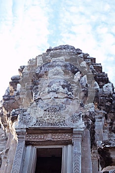 The upper part of one of the towers of the Angkor temple complex. The architectural art of the ancient Khmer