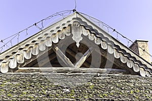 The upper part of the wooden gable roof.