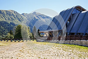 Upper station of the cable car in Caucasus mountains with the apiary in front of it. Krasnaya Polyana, Russia