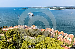 Upper view on roofs of old european marine town near sea bay