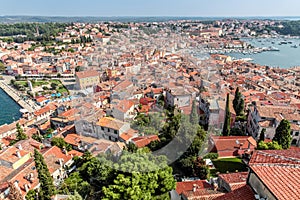 Upper view on roofs of old european marine town near sea bay