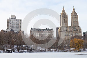 The Upper West Side Skyline with the Frozen Lake with Snow at Central Park in New York City during Winter