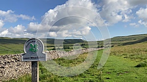 Upper Wharfedale National Trust Sign and footpath in the Yorkshire Dales