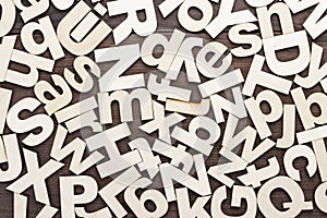 Uppercase and lowercase wooden letters background