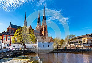 Uppsala cathedral reflecting on river Fyris in Sweden