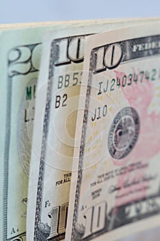 Upright ten and twenty dollar bills closeup. Macro view