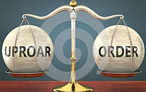 Uproar and order staying in balance - pictured as a metal scale with weights and labels uproar and order to symbolize balance and