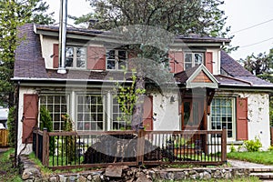 Uprooted tree lands on home during storm