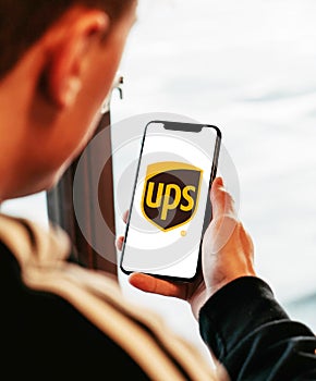 Ups on iphone in hand realistic texture