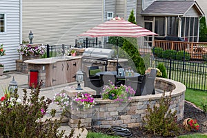 Upscale backyard round brick patio