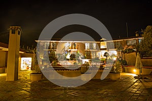 Upscale hotel and Inviting Courtyard and garden at night on Titikaka, Peru in South America photo