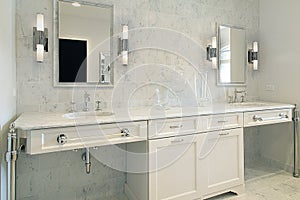 Upscale master bath with white cabinetry photo