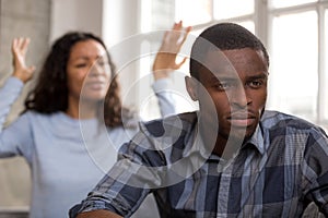 Upset african husband feels disappointed in love ignoring angry photo