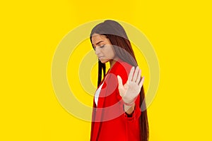 Upset angry woman giving talk to hand gesture with palm outward