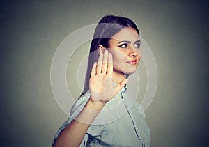 Upset angry woman giving talk to hand gesture with palm outward photo