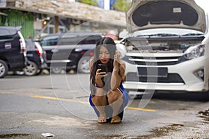 Upset Asian Japanese woman in stress stranded on street suffering car engine failure having mechanic problem calling to insurance