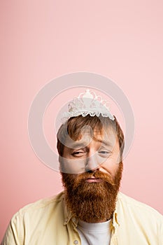 Upset bearded man with crown headband