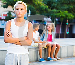 Upset boy after quarrel with playmates